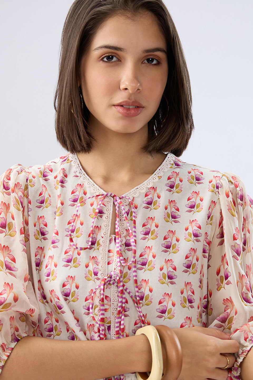 Ivory Floral Tie-up Peplum Top